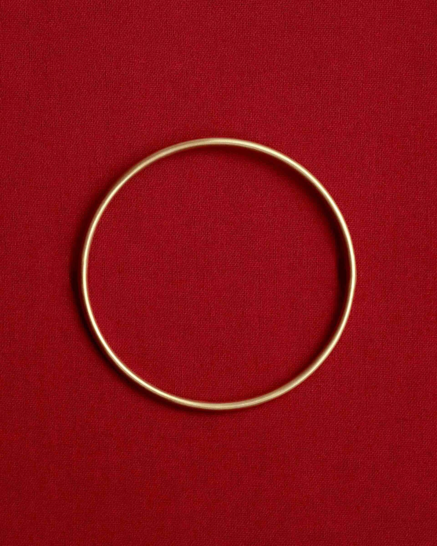 Tiana Marie Combes Classic Bangle in 14k Yellow Gold.