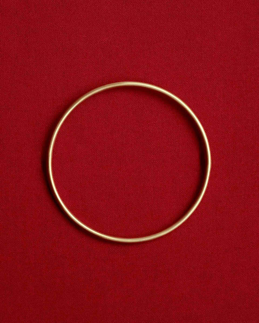 Tiana Marie Combes Classic Bangle in 14k Yellow Gold.